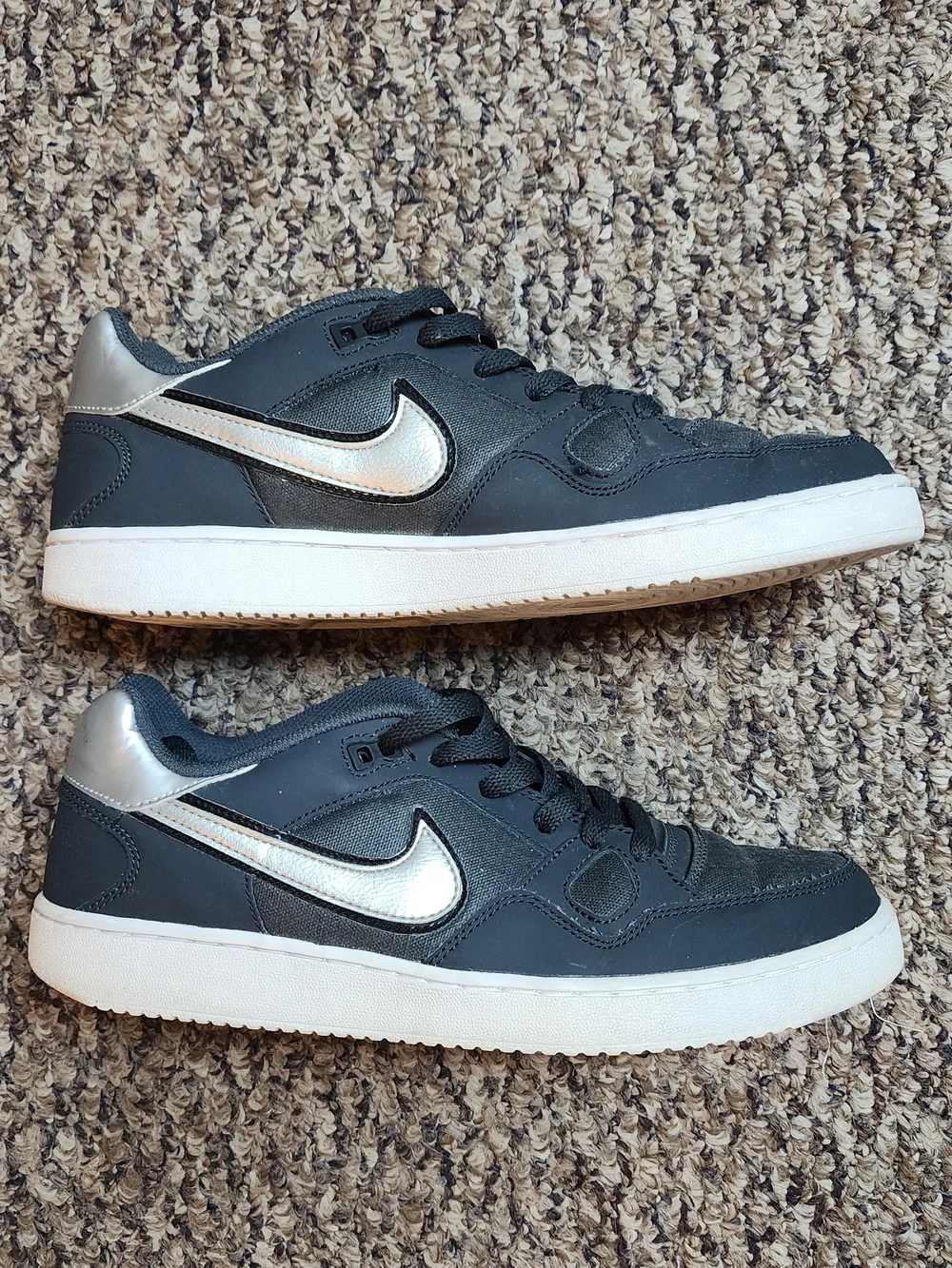 Nike Black Sneakers with Metallic Silver Swoosh and White Sole